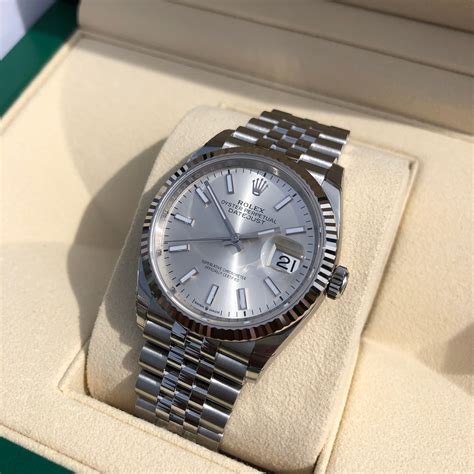 rolex silber|Rolex silver watch face.